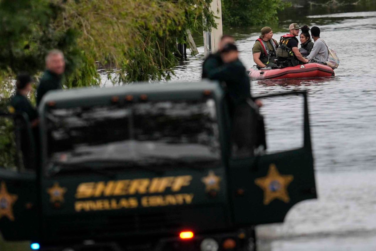 People are rescued from an apartment complex Thursday after heavy flooding in Clearwater, Florida.