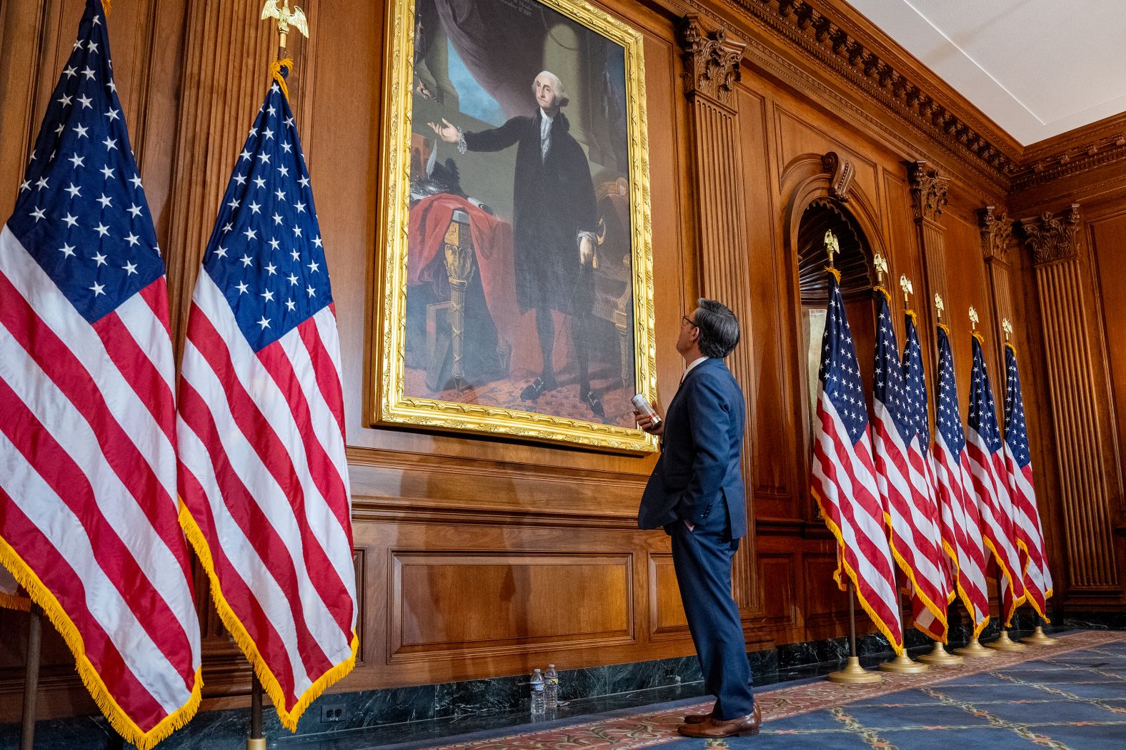 US House Speaker Mike Johnson stops to look at a painting of former President George Washington at the US Capitol on Friday, January 3. He was <a href="index.php?page=&url=https%3A%2F%2Fwww.cnn.com%2F2025%2F01%2F03%2Fpolitics%2Ftrump-influence-johnson-speakership-vote%2Findex.html">reelected speaker</a> that day.