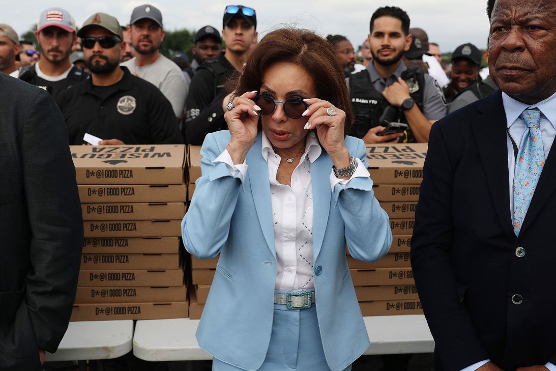 Jeanine Pirro adjusts her glasses as President Donald Trump and other administration officials visited law enforcement agents and National Guard troops at the US Park Police Anacostia Operations Facility in Washington, DC, on August 21.
