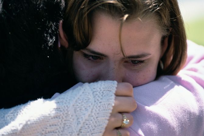 People wait for news of friends and family in the aftermath of the bombing.