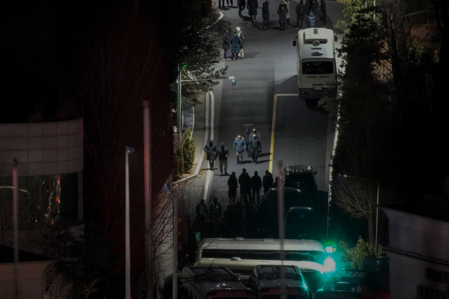 Presidential bodyguards gather at the main entrance of the official residence of Yoon Suk Yeol, South Korea's impeached president, in Seoul on Wednesday, January 15. <a href="index.php?page=&url=https%3A%2F%2Fwww.cnn.com%2F2025%2F01%2F14%2Fasia%2Fsouth-korea-yoon-suk-yeol-residence-intl%2Findex.html">Yoon was arrested for questioning</a> in multiple criminal investigations related to his martial law decree last month.