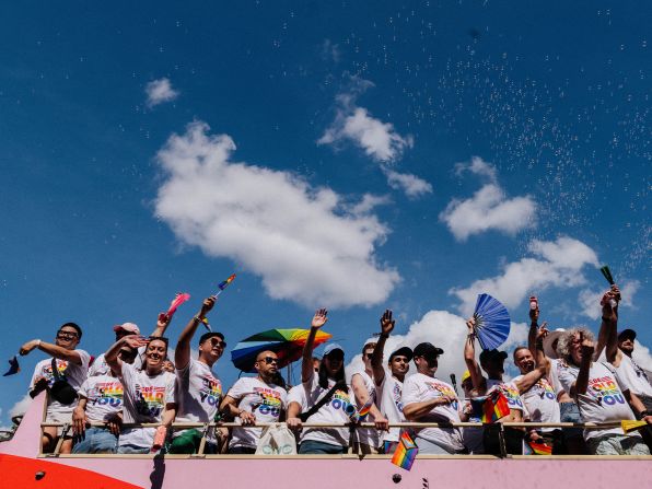 People wave from a parade float during the <a  target="_top" href="/newspapers?url=https://www.cnn.com/2025/06/08/politics/dc-world-pride-lgbtq-trump">World Pride parade</a> in Washington, DC, on Saturday, June 7.
