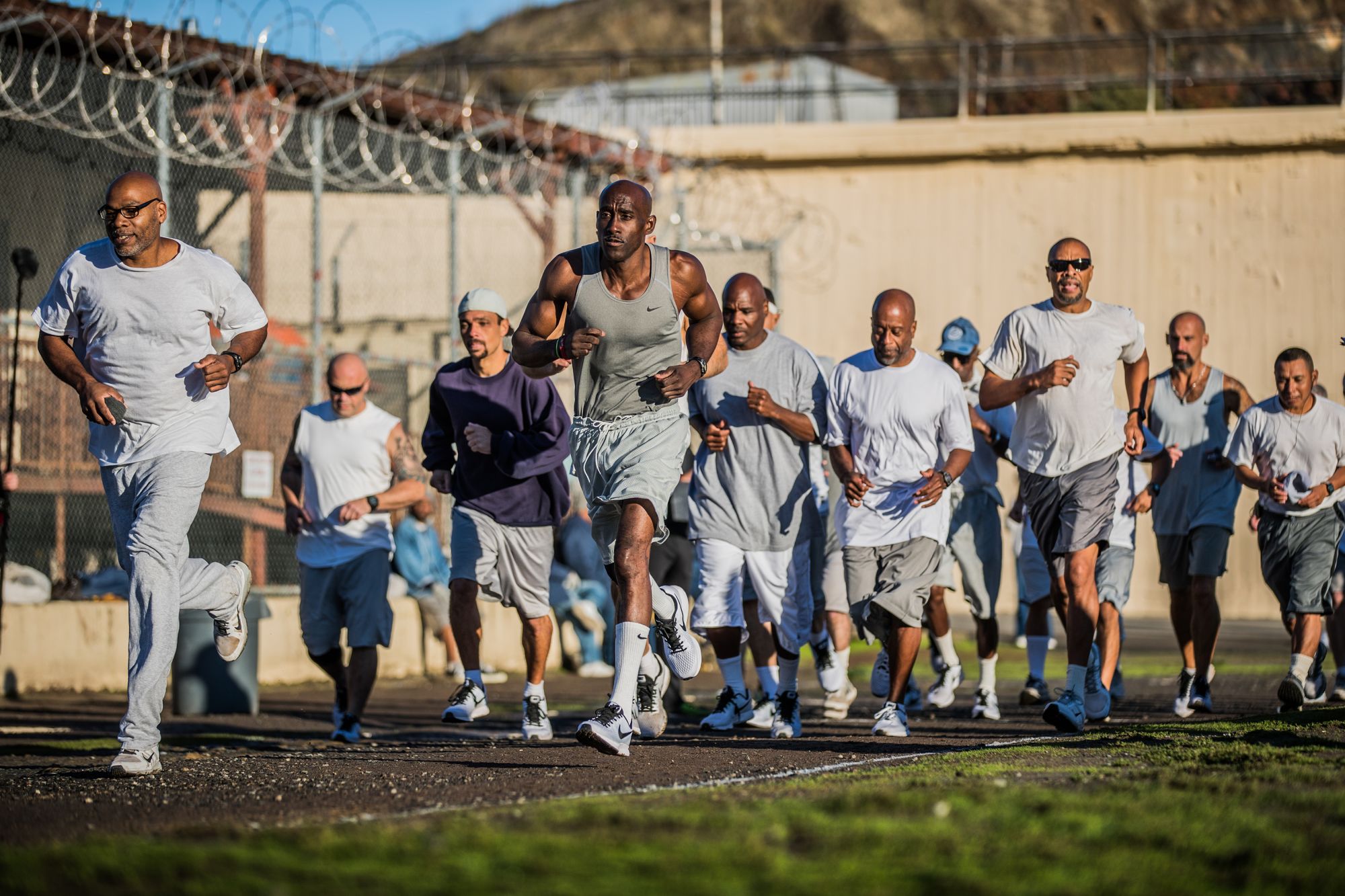 Inmates run 105 laps of the prison yard in order to complete the marathon.