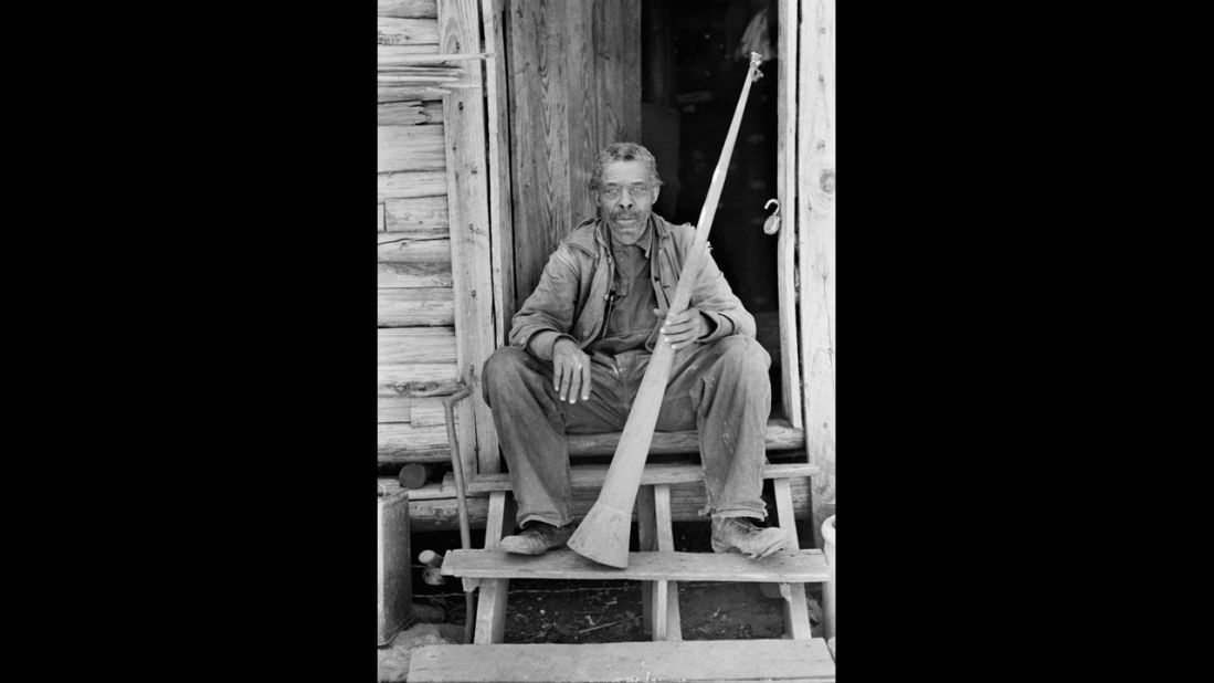 Near Marshall, Texas, in 1939, a formerly enslaved man holds a horn with which slaves were called.