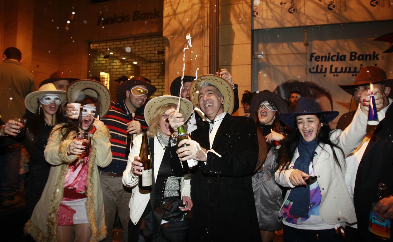 Partiers in Beirut, Lebanon, celebrate the new year early Tuesday.