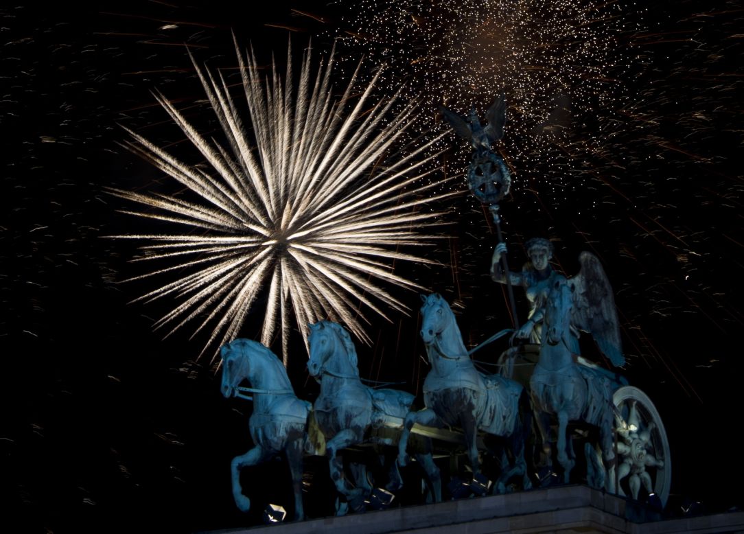 Fireworks erupt over the Brandenburg Gate on New Year's Eve in Berlin.