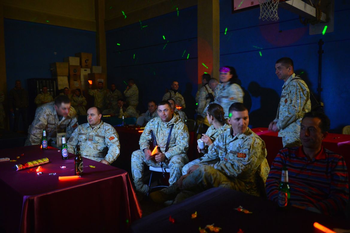 NATO troops from the International Security Assistance Force look on during celebrations on New Year's Eve right before the start of 2013 in Kabul, Afghanistan.
