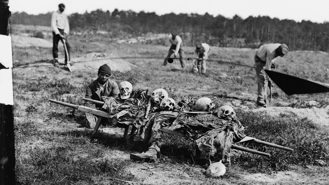 The bones of soldiers killed in battle are collected in Cold Harbor, Virginia, in 1865.
