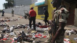 Clothing and various items are scattered on the pavement at the scene of a stampede in Abidjan, on January 1, 2013.