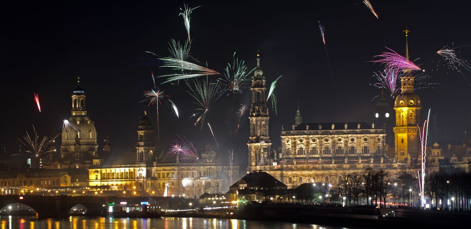 Fireworks erupt over on the Elbe River during New Year's Eve celebrations in Dresden.