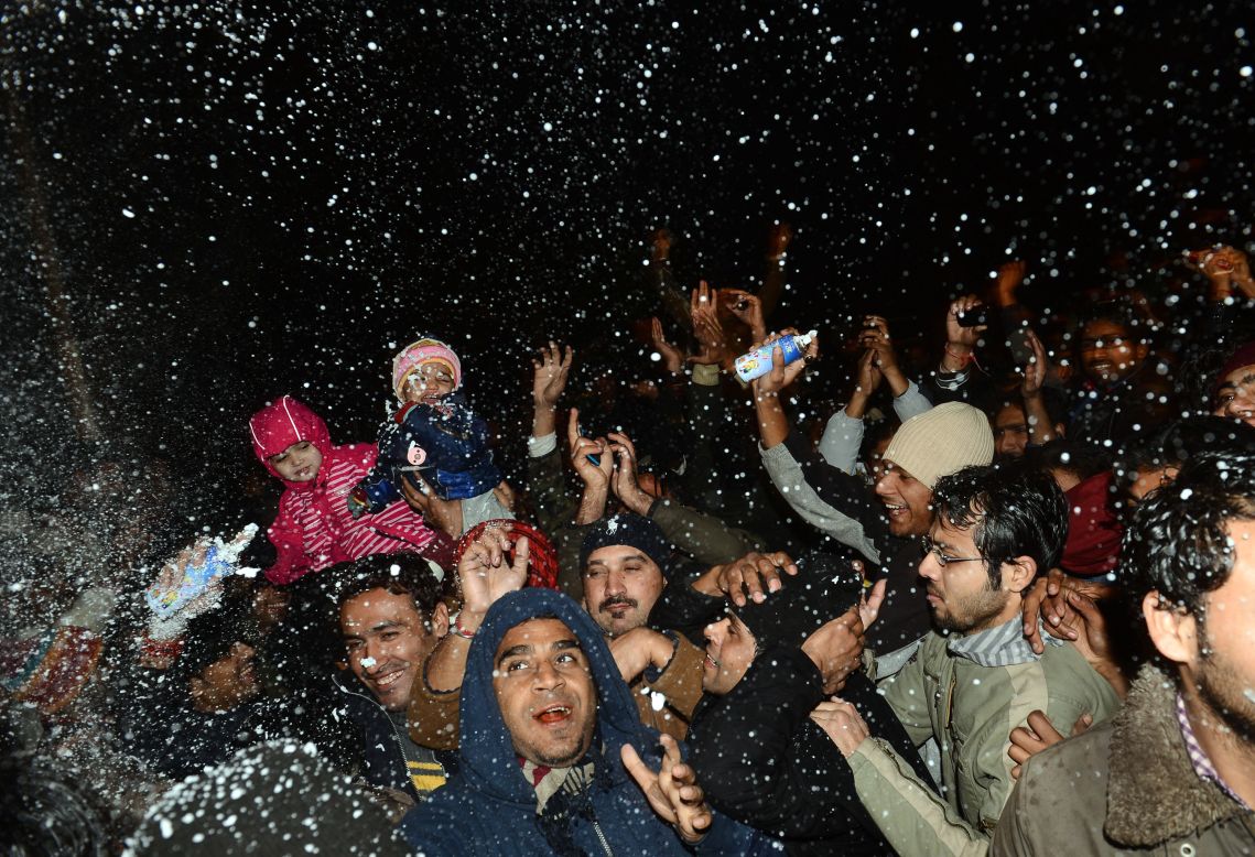 Pakistani youths celebrate the new year on a street in Lahore early Tuesday.