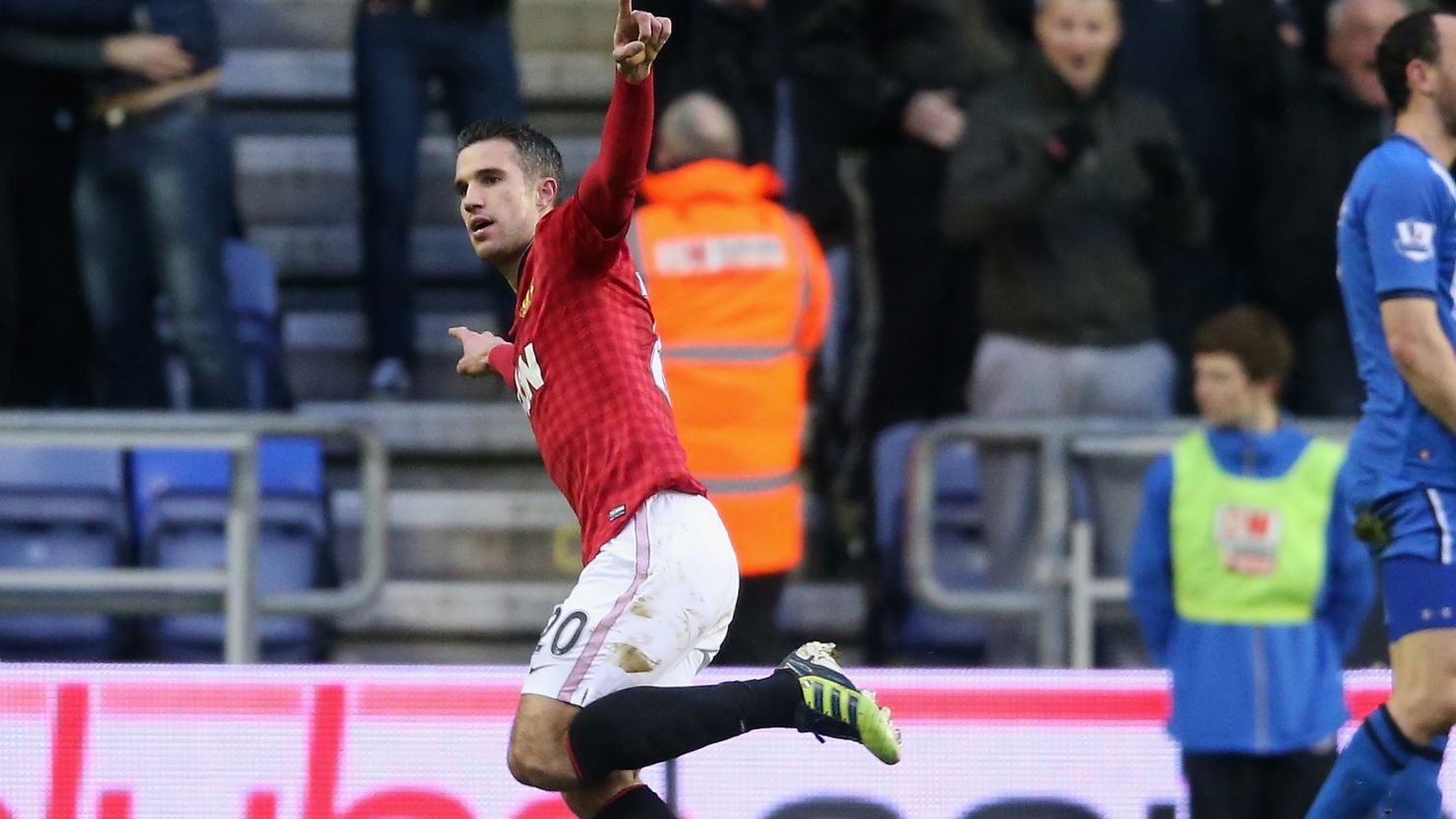 Robin van Persie wheels away after scoring Manchester United's second goal in the 4-0 win over Wigan.