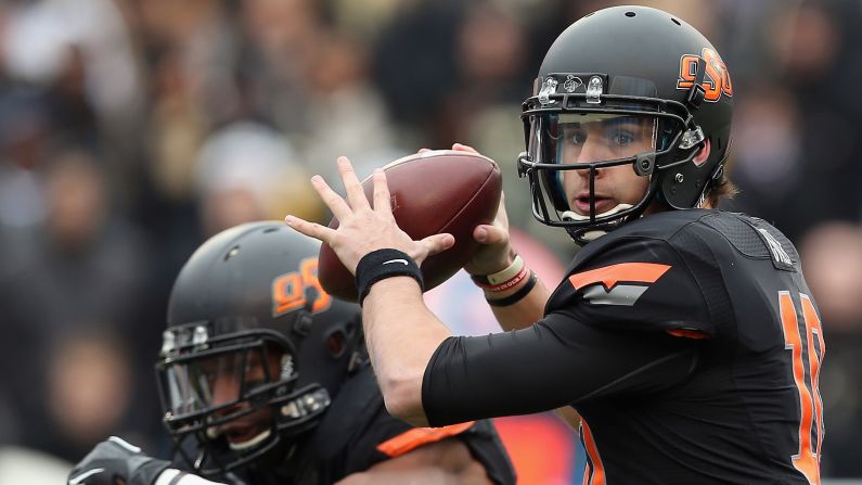 Clint Chelf of the Oklahoma State Cowboys passes against the Purdue Boilermakers on January 1 in Dallas.