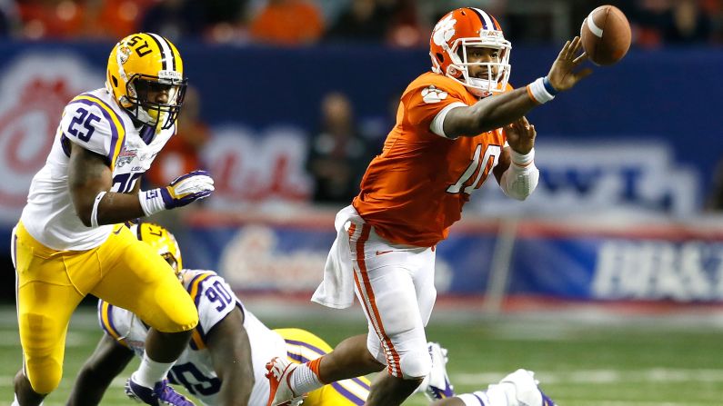 Tajh Boyd of the Clemson Tigers pitches the ball away from Kwon Alexander of the LSU Tigers on December 31.