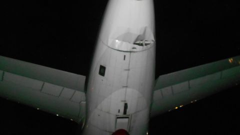 The tail of a US Airways plane shows damage caused by a collision with a Spirit Airlines plane, Monday.