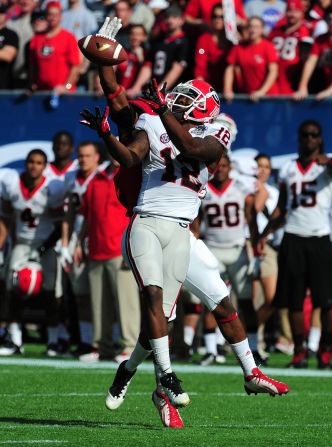 Tavarres King of the Georgia Bulldogs makes a catch for a touchdown against Andrew Green of the Nebraska Cornhuskers on January 1.