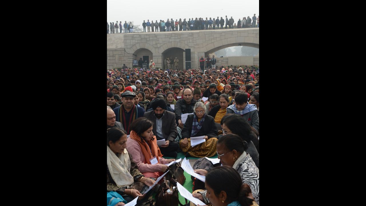Delhi Chief Minister Sheila Dikshit, center, participates in a group prayer during the Women's Dignity March on January 2.