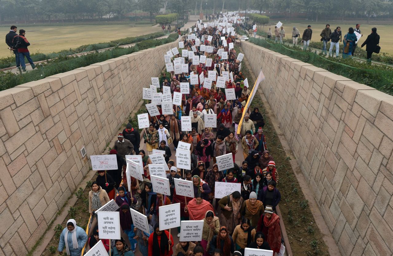 Indian women take part in the Women's Dignity March in New Delhi on Wednesday, January 2. Several hundred people participated in the solidarity march organized by the government, which ended at Rajghat, the memorial for Mohandas Gandhi.