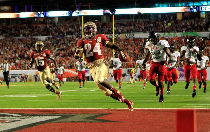 Lonnie Pryor of the Florida State Seminoles scores a 60-yard rushing touchdown in the first quarter against the Northern Illinois Huskies January 1.