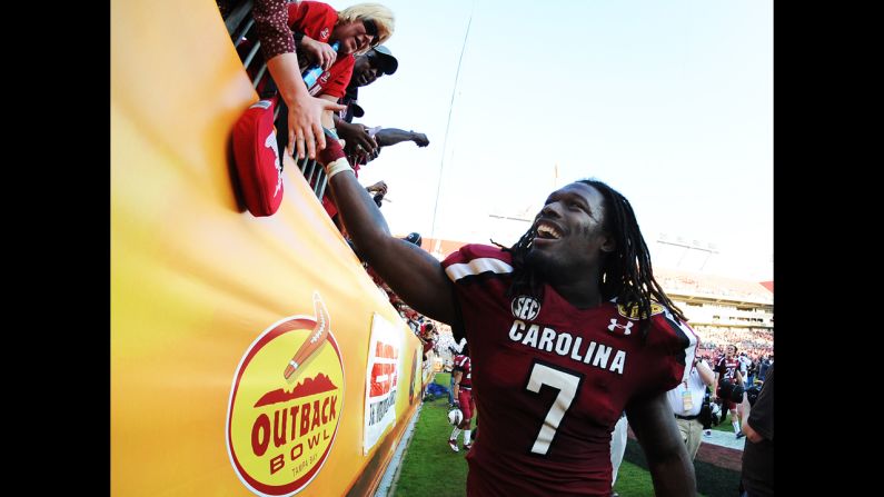 Defensive end Jadeveon Clowney of the South Carolina Gamecocks celebrates after a 33-28  victory over the Michigan Wolverines in the Outback Bowl on January 1 at Raymond James Stadium in Tampa, Florida.