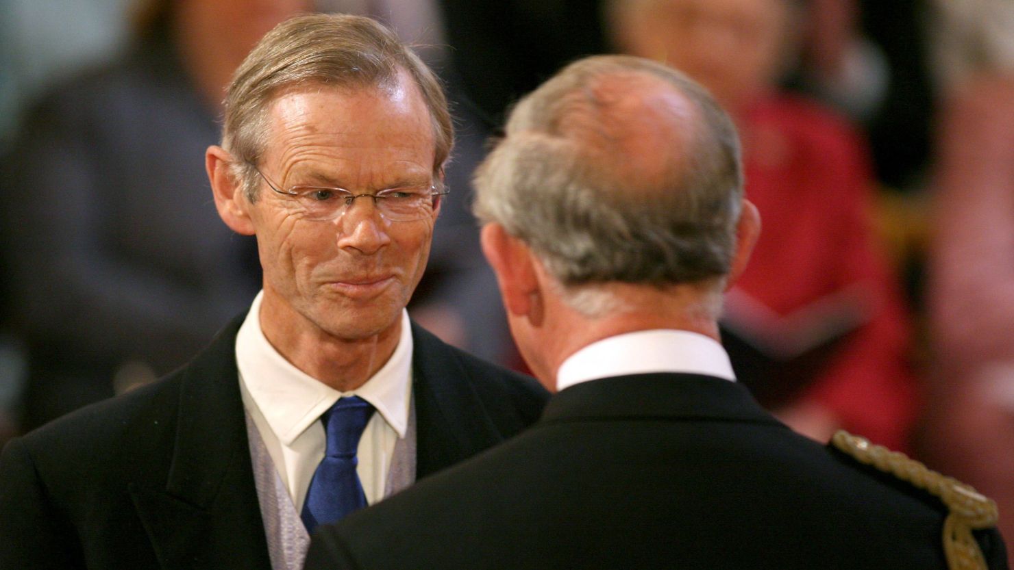 Cricket journalist Christopher Martin-Jenkins receives the MBE from Prince Charles at Buckingham Palace in May 2009 in London.