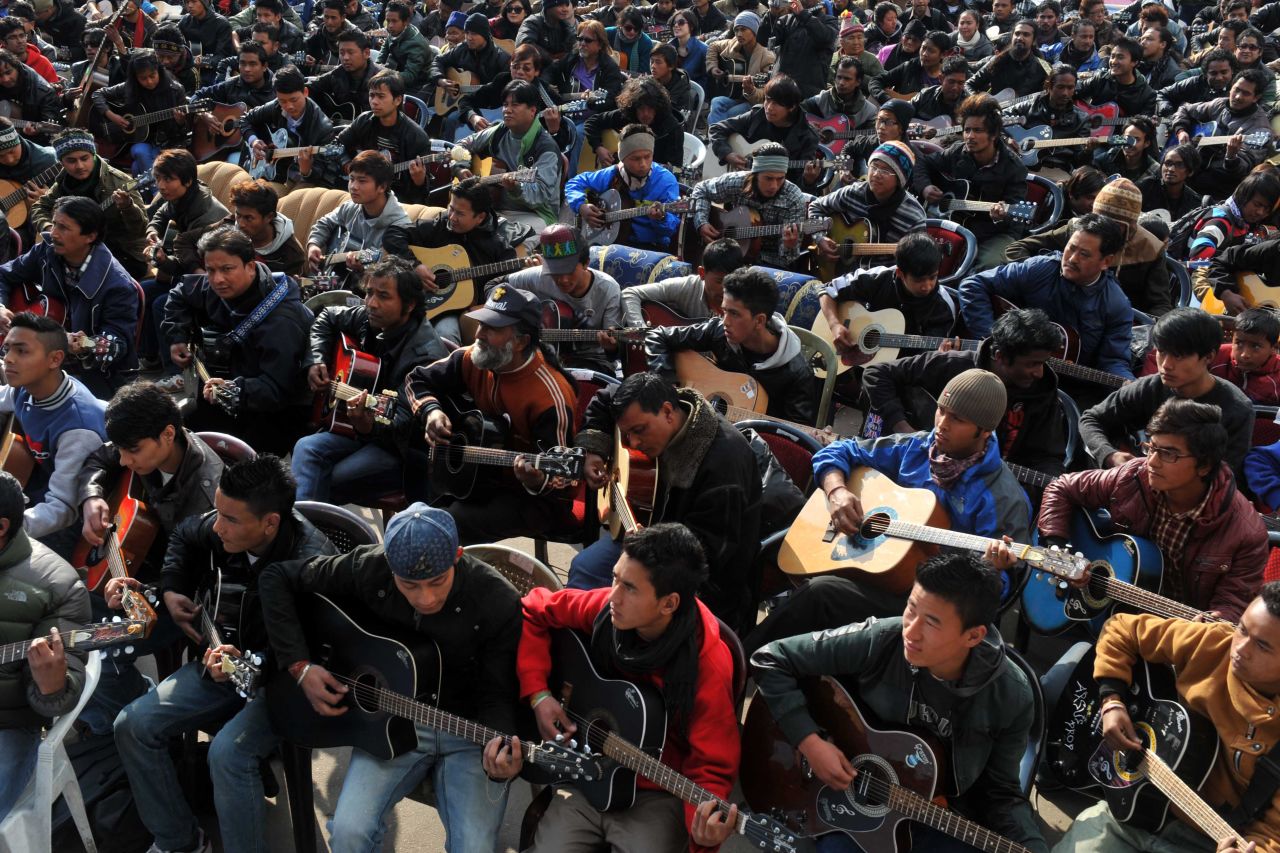 About 600 guitarists play John Lennon's "Imagine" in a tribute to the rape victim in Darjeeling on January 3. 