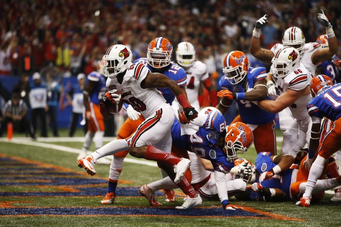 Jeremy Wright of the Louisville Cardinals crosses the goal line for a touchdown against the Florida Gators on January 2.
