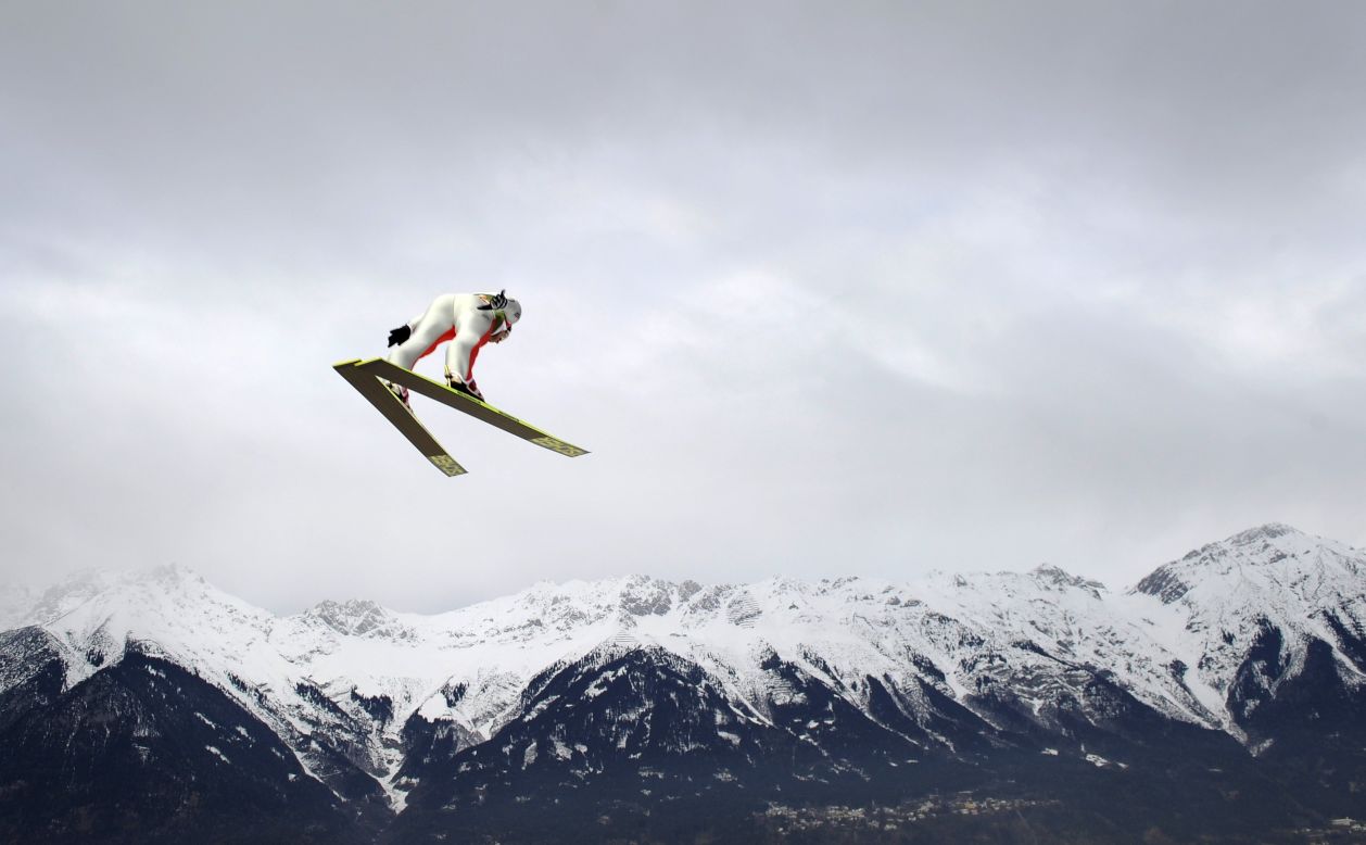 Simon Ammann of Switzerland becomes part of an Alpine view during a training jump on January 3.