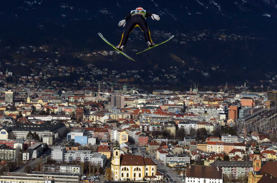 Richard Freitag of Germany soars over the skyline of Innsbruck, Austria, during the training round on Thursday, January 3. 