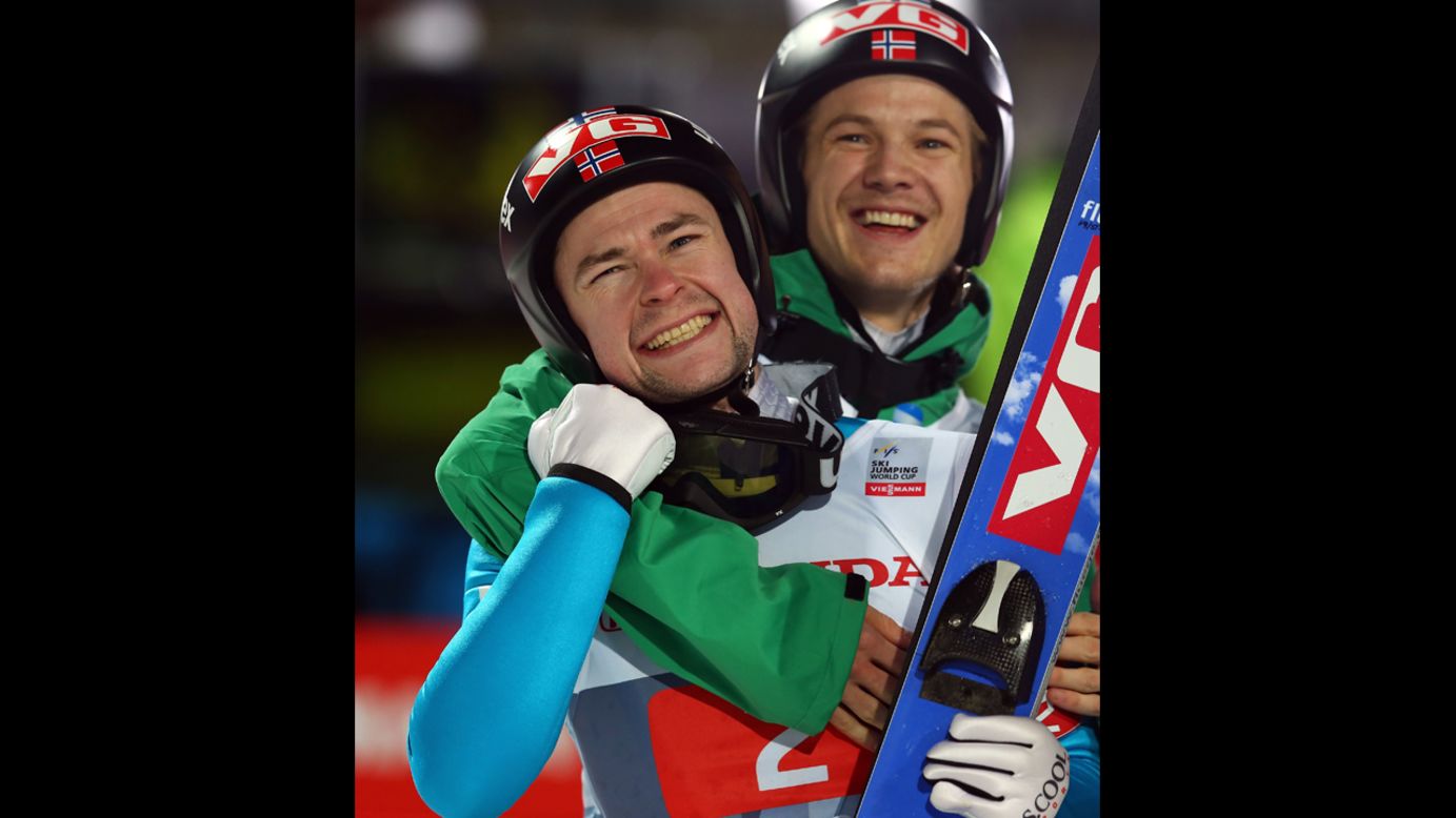 Anders Jacobsen of Norway, left, celebrates with teammate Tom Hilde after winning the final-round second leg at Erdinger Arena on Sunday, December 30, in Oberstdorf, Germany.