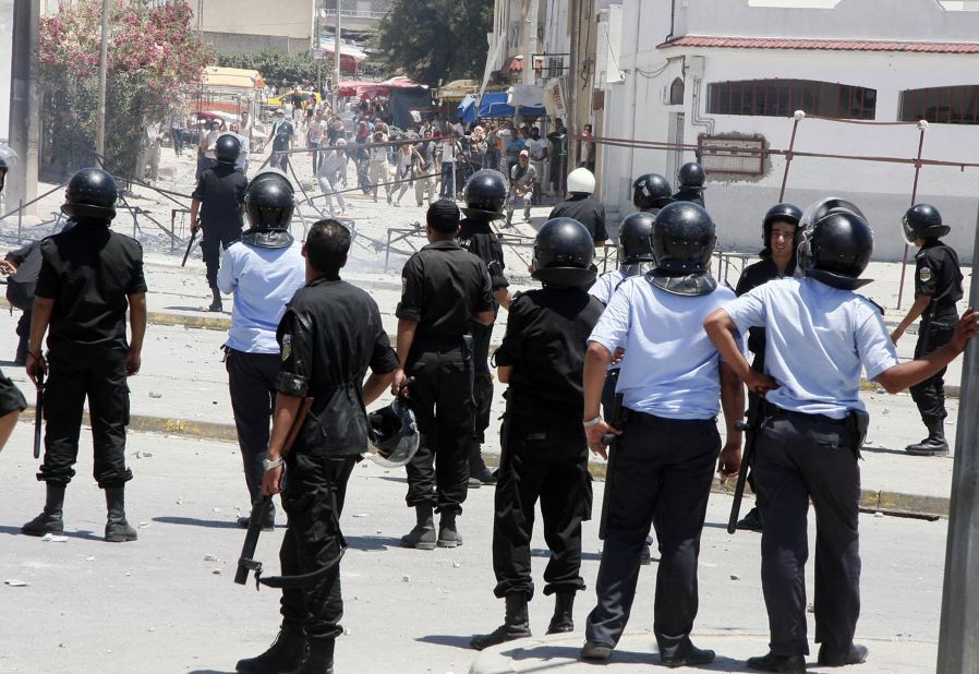 Tunisian police square off with protesters, including ultra-conservative Salafists, in Intilaka, west of Tunis in June 2012 during a wave of unrest triggered by the art exhibition. 