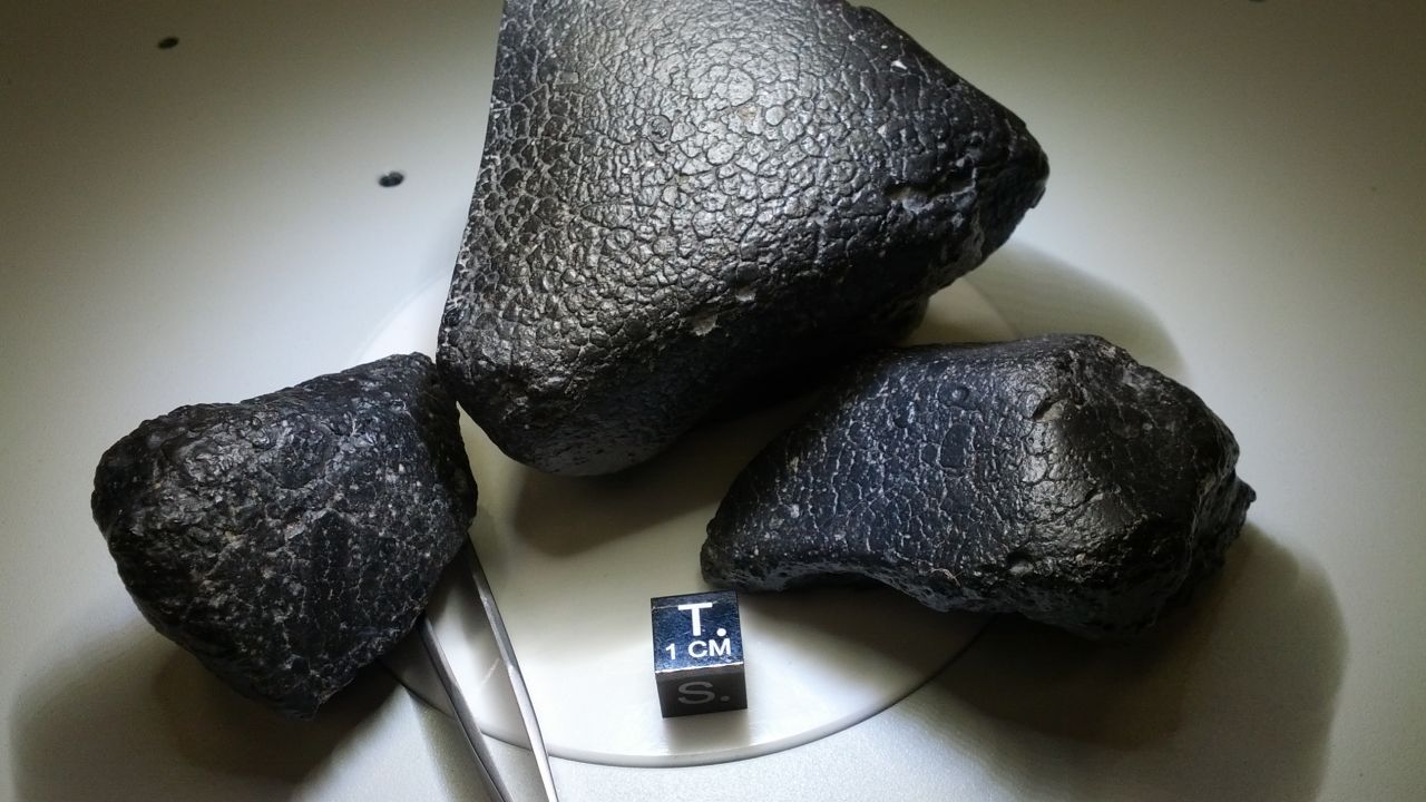 These three pieces are from the same meteorite. Scientists say they are rare specimens from the crust of Mars.