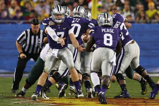 Quarterback Collin Klein pitches the ball to Angelo Pease of the Kansas State Wildcats during a play against the Oregon Ducks on January 3.