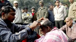 An Indian activist gets his head shaven in protest against the Dehli gang-rape in New Delhi on Friday, January 4. A gang of men is accused of repeatedly raping a 23-year-old student on a moving bus in New Delhi. Police formally charged the five suspects with rape, kidnapping and murder after the woman died.