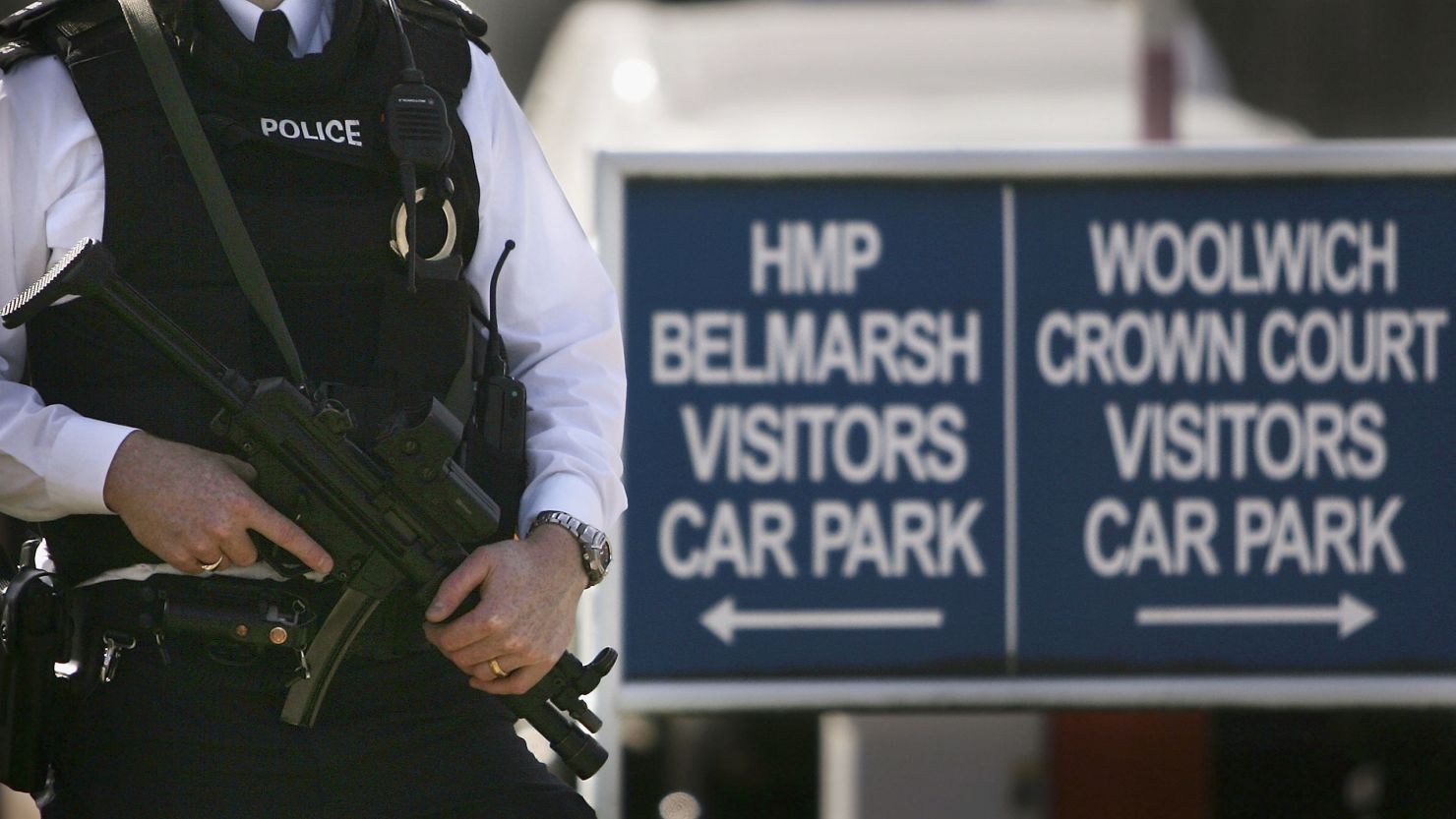 A file image of an armed police officer standing outside Belmarsh prison and Law Courts, August 8, 2005.