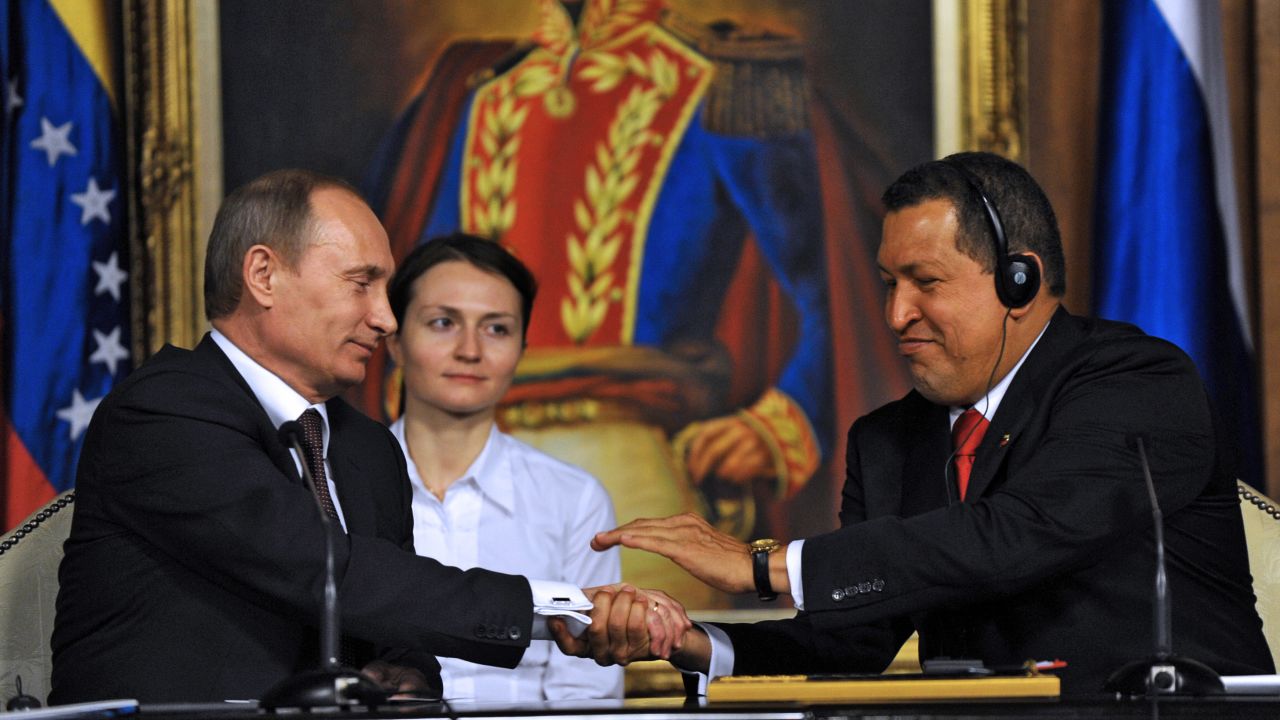 Chavez, right, greets Russian Prime Minister Vladimir Putin during his visit to the presidential palace in Caracas on April 2, 2010. 