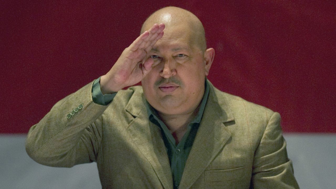 Chavez salutes to the audience after passing a law in Caracas on November 12, 2011. Chavez has undergone several rounds of cancer treatment in Cuba, beginning in 2011. 