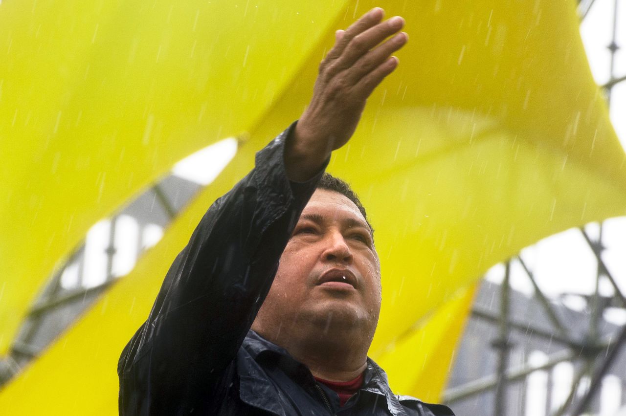 Chavez gestures to the crowd during his closing campaign rally in Caracas on October 4, 2012. The leftist leader won a fourth term on October 7, extending his presidency to 2019.