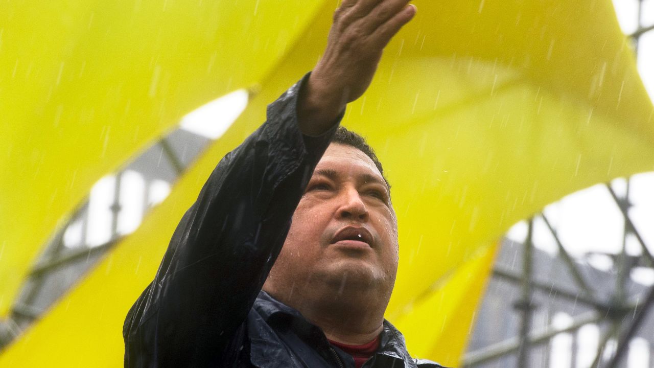 Chavez gestures to the crowd during his closing campaign rally in Caracas on October 4, 2012. The leftist leader won a fourth term on October 7, extending his presidency to 2019.