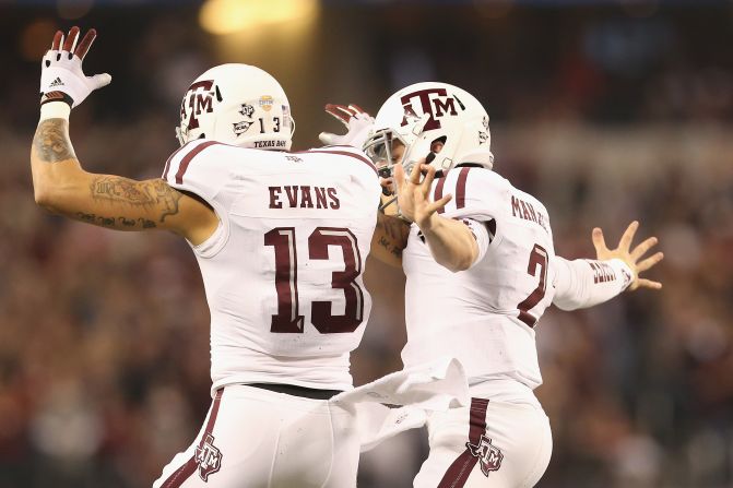 Johnny Manziel of the Texas A&M Aggies celebrates his touchdown with Mike Evans against the Oklahoma Sooners on January 4.