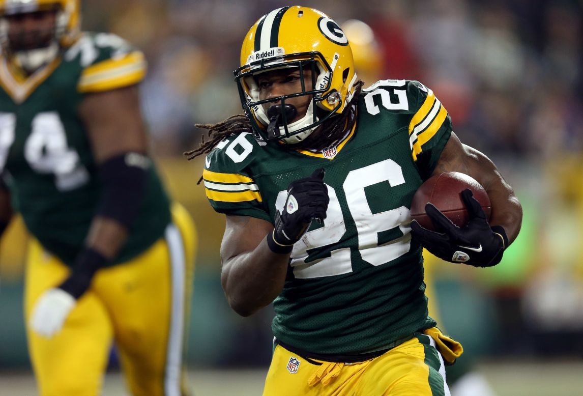DuJuan Harris of the Green Bay Packers runs the ball in the first quarter.