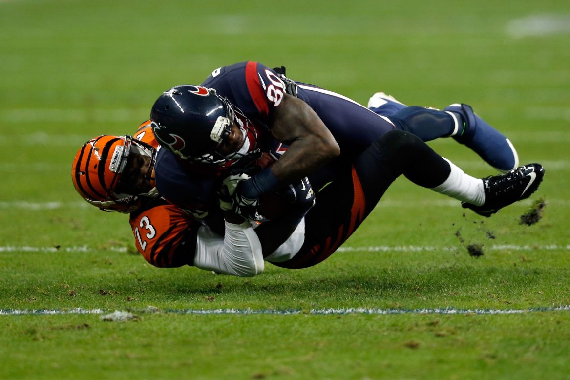 Andre Johnson of the Houston Texans makes a catch against Terence Newman of the Cincinnati Bengals during their AFC Wild Card Playoff Game at Reliant Stadium on Saturday in Houston.