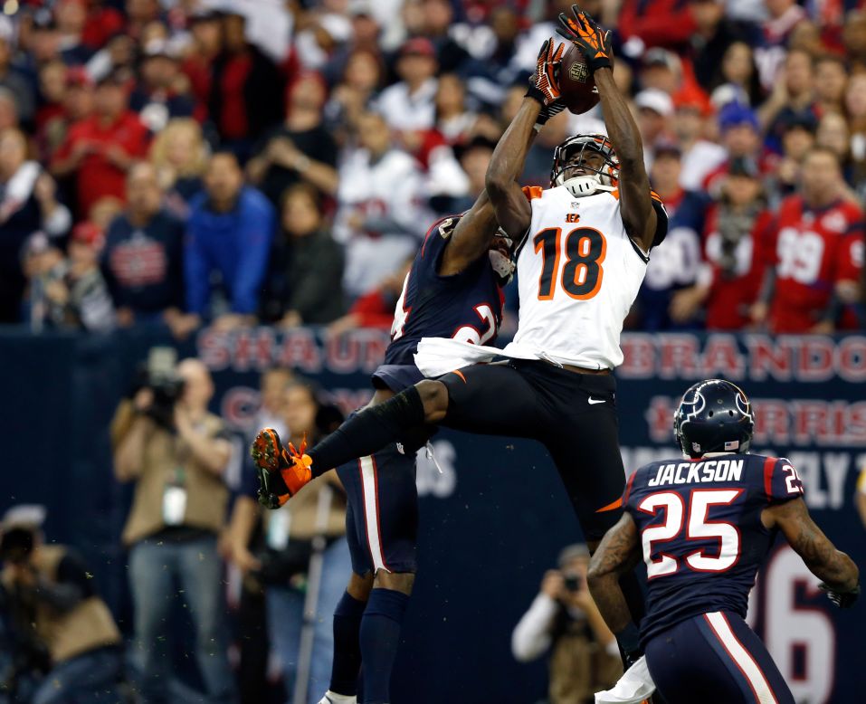 A.J. Green of the Cincinnati Bengals misses a catch against Johnathan Joseph, left, and Kareem Jackson, right, of the Houston Texans on Saturday.