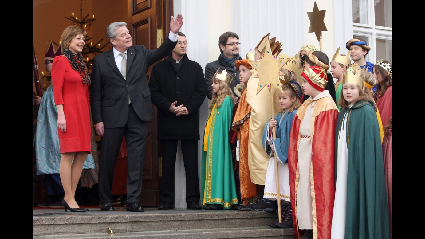 Child Epiphany carolers, known as Sternsinger in German, visit German President Joachim Gauck, second from left, and his partner, Daniela Schadt, left, at Bellevue presidential palace on January 6 in Berlin. The children, dressed as the Three Magi, walk from house to house in the days around January 6 singing carols and collecting money for needy children.