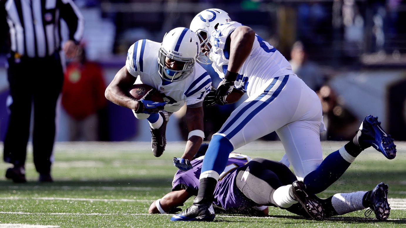 T.Y. Hilton of the Indianapolis Colts is tripped up by Cary Williams of the Baltimore Ravens on Sunday.