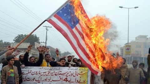 Demonstrators burn a U.S. flag during a protest in Multan on January 3, 2013, against drone attacks in Pakistan's tribal areas.