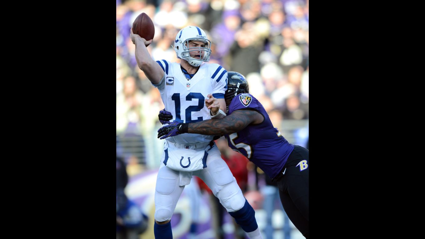 Andrew Luck of the Indianapolis Colts attempts to pass against Terrell Suggs of the Baltimore Ravens on Sunday.