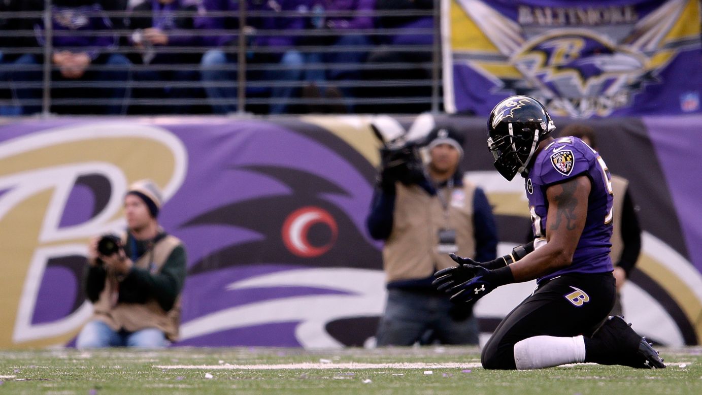 Ray Lewis of the Baltimore Ravens kneels on the field in the fourth quarter against the Indianapolis Colts on Sunday.
