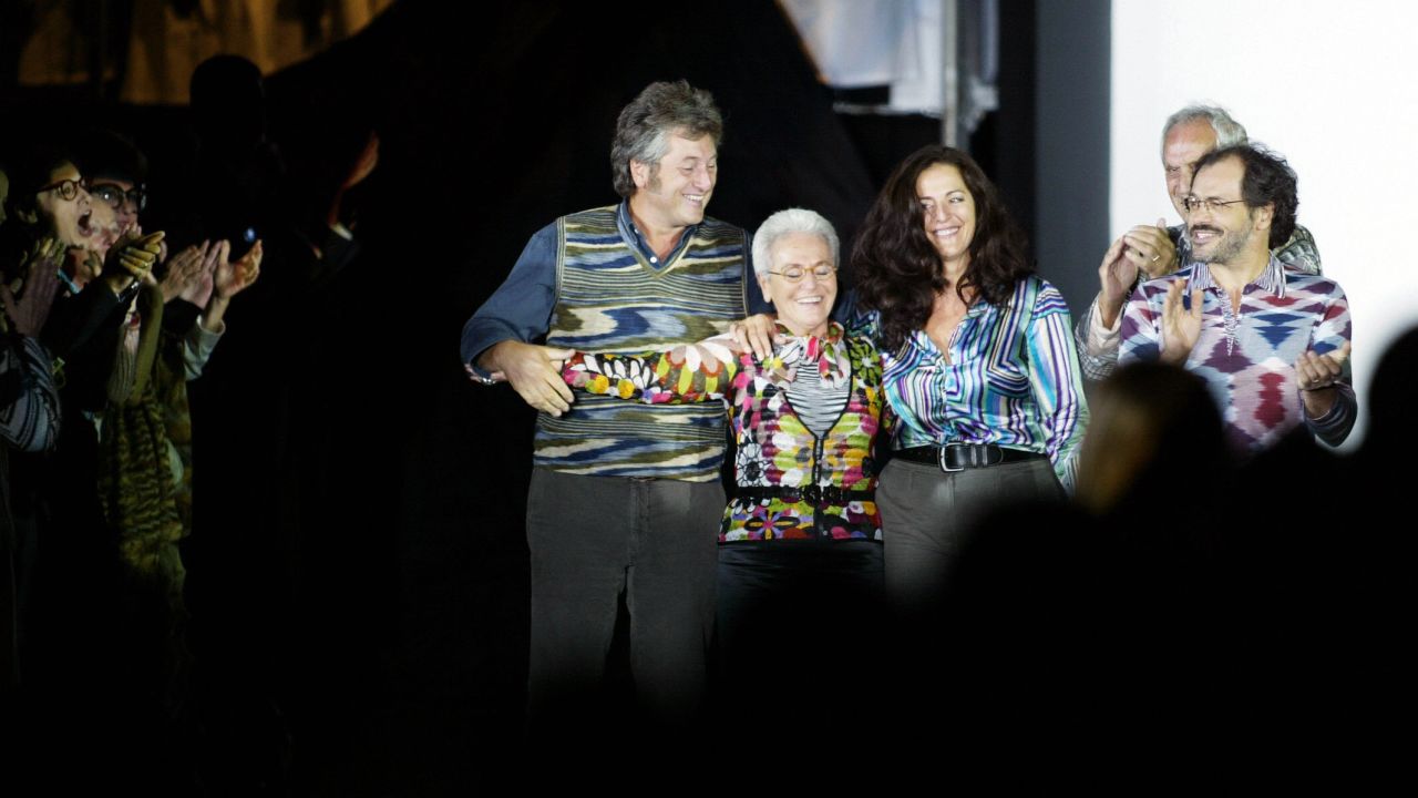 From left: Vittorio, Rosita (his mother), Angela (his sister), Ottavio (his father) and Luca (his brother) acknowledge applause on the catwalk at the end of the Missoni collection during the last day of Milan's 2004 spring/summer fashion week on October 5, 2003. The show marked 50 years since the company was founded by Ottavio (nicknamed "Tai ") and Rosita and 50 years since they married. Vittorio Missoni and his siblings took over the brand in 1996.