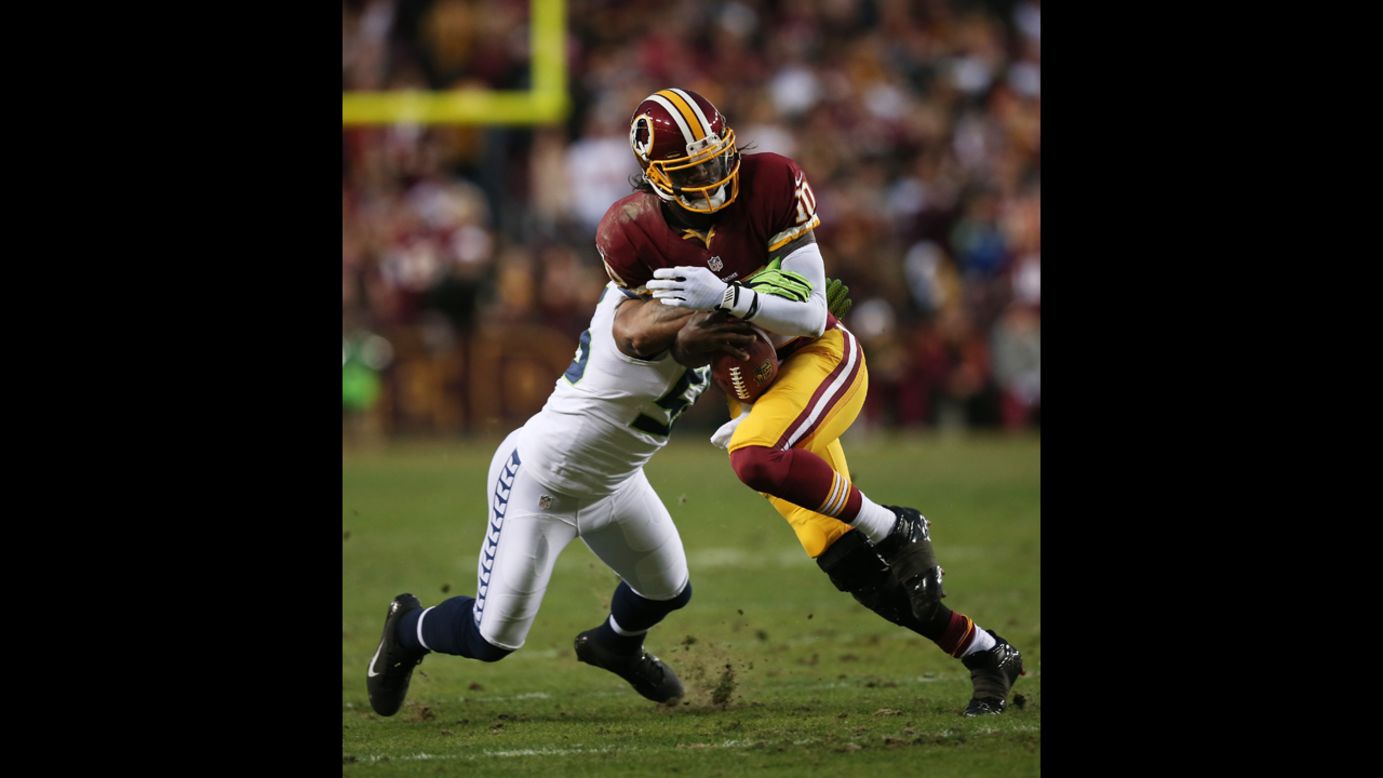 Robert Griffin III of the Washington Redskins is tackled by Leroy Hill of the Seattle Seahawks on Sunday.
